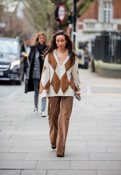 LONDON, ENGLAND - FEBRUARY 21: Elizabeth von der Goltz seen wearing brown creme white checkered jump...