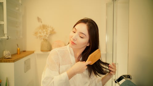 Beautiful woman singing in the bathroom. Smiling and posing