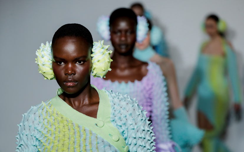 LONDON, ENGLAND - FEBRUARY 20: Models walk the runway for Chet Lo at the Fashion East show during Lo...