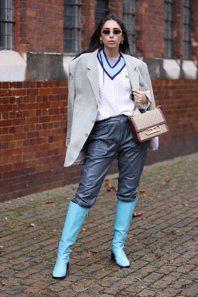 LONDON, ENGLAND - FEBRUARY 18: Gabriella Berdugo wearing Lacoste jumper, turquoise knee high boots w...