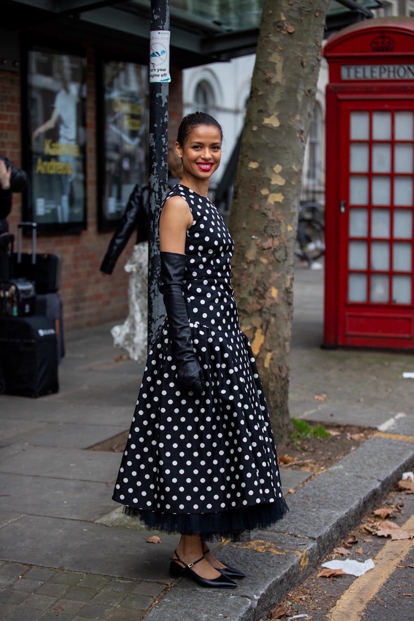 LONDON, ENGLAND - FEBRUARY 21: Actress  Gugu Mbatha-Raw seen wearing black white dress with dots, gl...