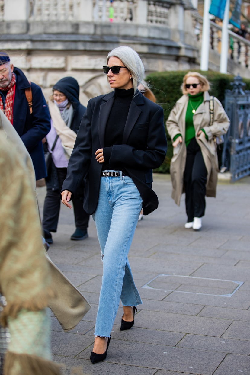 LONDON, ENGLAND - FEBRUARY 21: Sarah Harris seen wearing ripped denim jeans, Chanel belt, navy blaze...