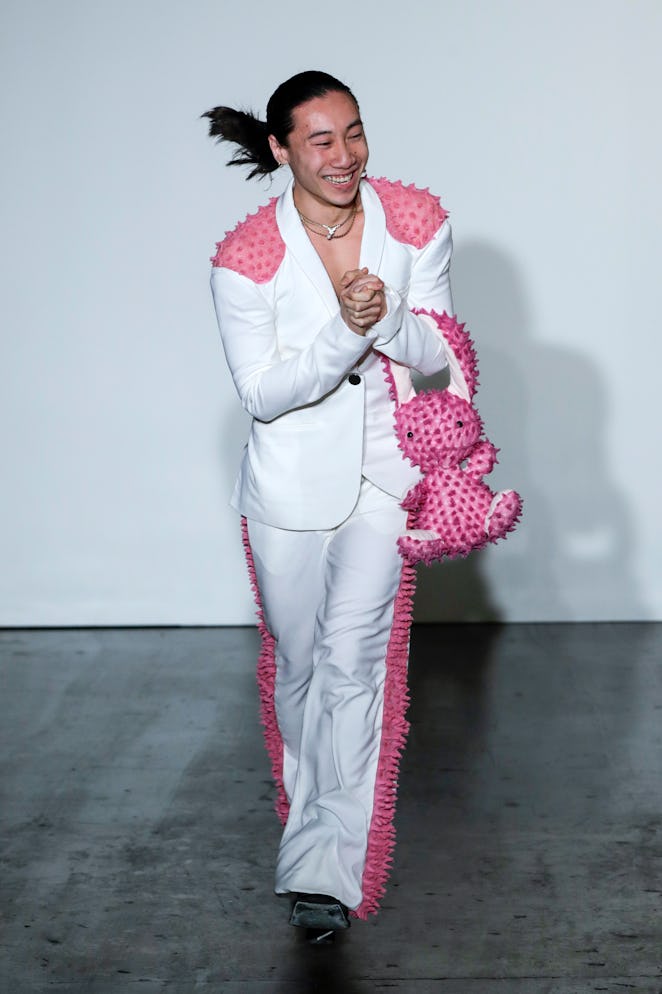 LONDON, ENGLAND - FEBRUARY 20: Designer Chet Lo walks the runway at the Fashion East show during Lon...