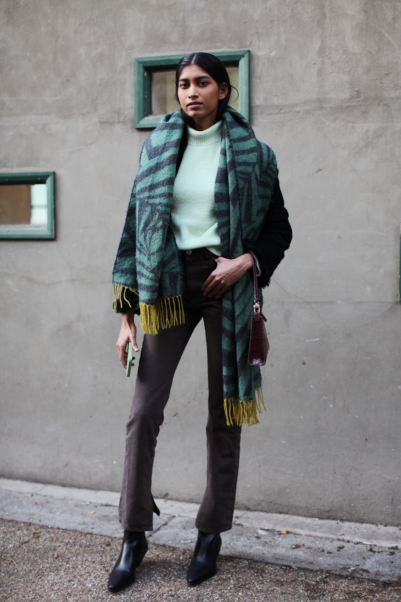 LONDON, ENGLAND - FEBRUARY 18: A model is seen wearing a Pastel Green Top at Edward Crutchley during...