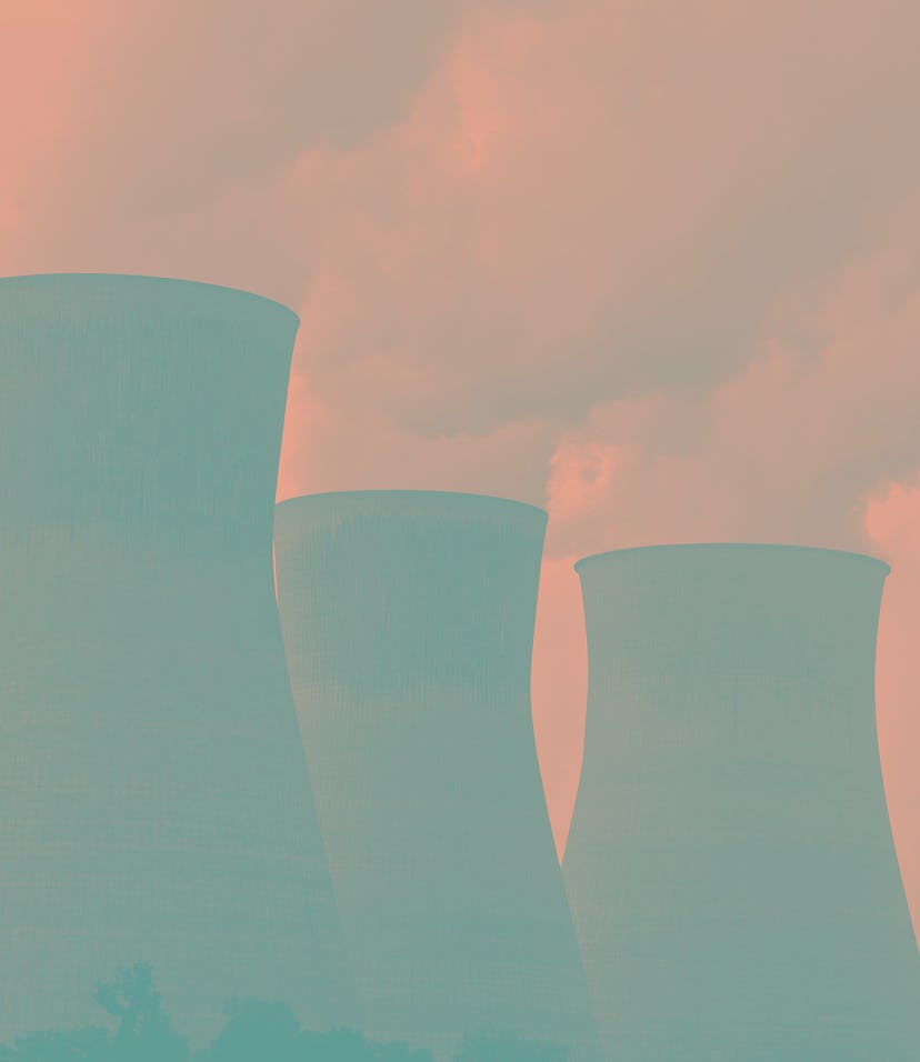 2007 - Smoke fills the air from cooling towers of a power plant along a river. (Photo by: HUM Images...