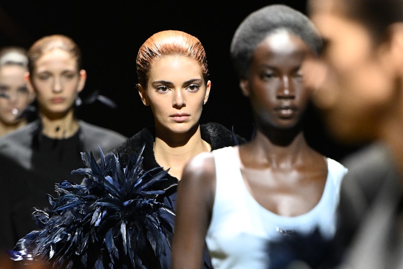 Kendall Jenner debuts red hair at the Prada show during Milan Fashion Week Fall/Winter 2022/2023.