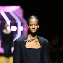 MILAN, ITALY - FEBRUARY 24: A model walks the runway at the Prada fashion show during the Milan Fash...