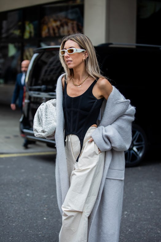 Street style of a corset and drawstring pants.