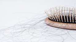 hairbrush with hair in it