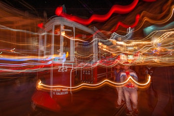 Istanbul, Turkey - October 2, 2010: At night, the nostalgic tram passes through Beyoğlu, taking its ...
