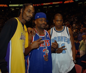EAST RUTHERFORD, NJ - June 12:   Hip hop artists Snoop Dogg poses for photographers with Damon Dash ...