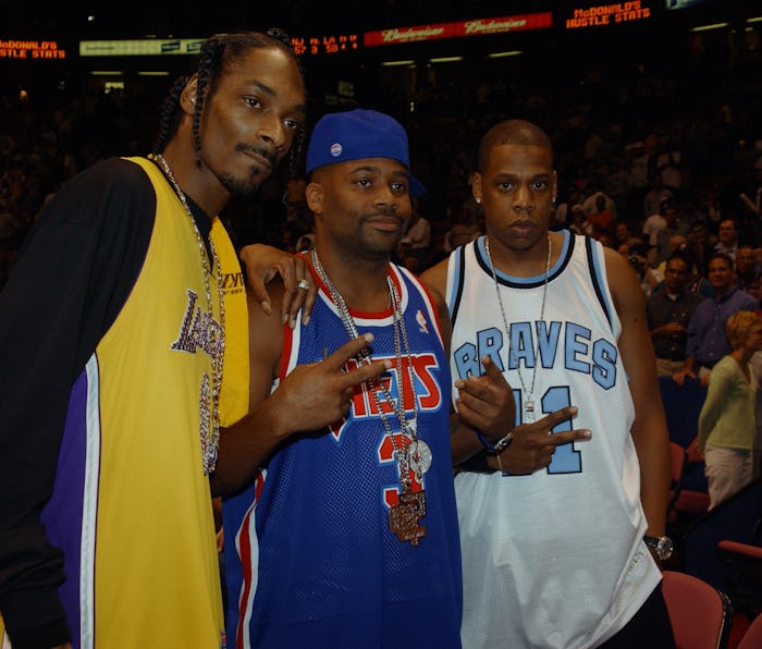 EAST RUTHERFORD, NJ - June 12: Hip hop artists Snoop Dogg poses for photographers with Damon Dash ...
