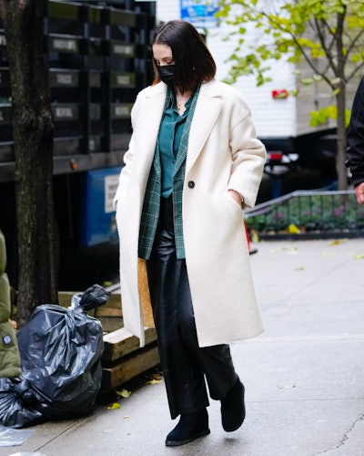 Selena Gomez wears off-white Zara coat.