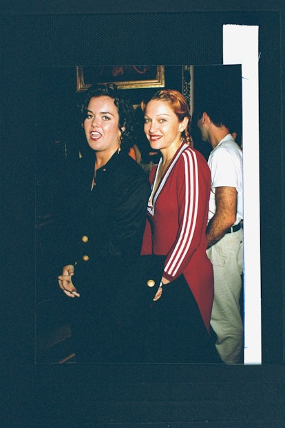 Actress/singer Madonna (R) wearing low-cut maroon cotton adidas dress, posing w. actress Rosie O'Don...
