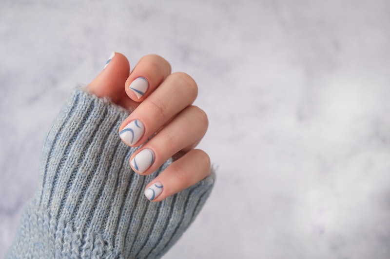 Stylish blue female nails. Modern trendy stylish Beautiful manicure. Autumn winter nail minimalistic...