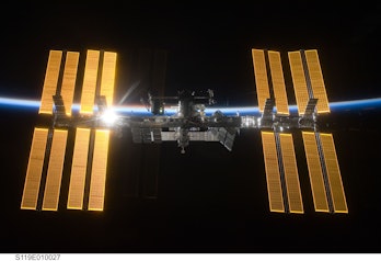International Space Station, March 2009. Backlit view of the ISS with solar array. Artist . (Photo b...