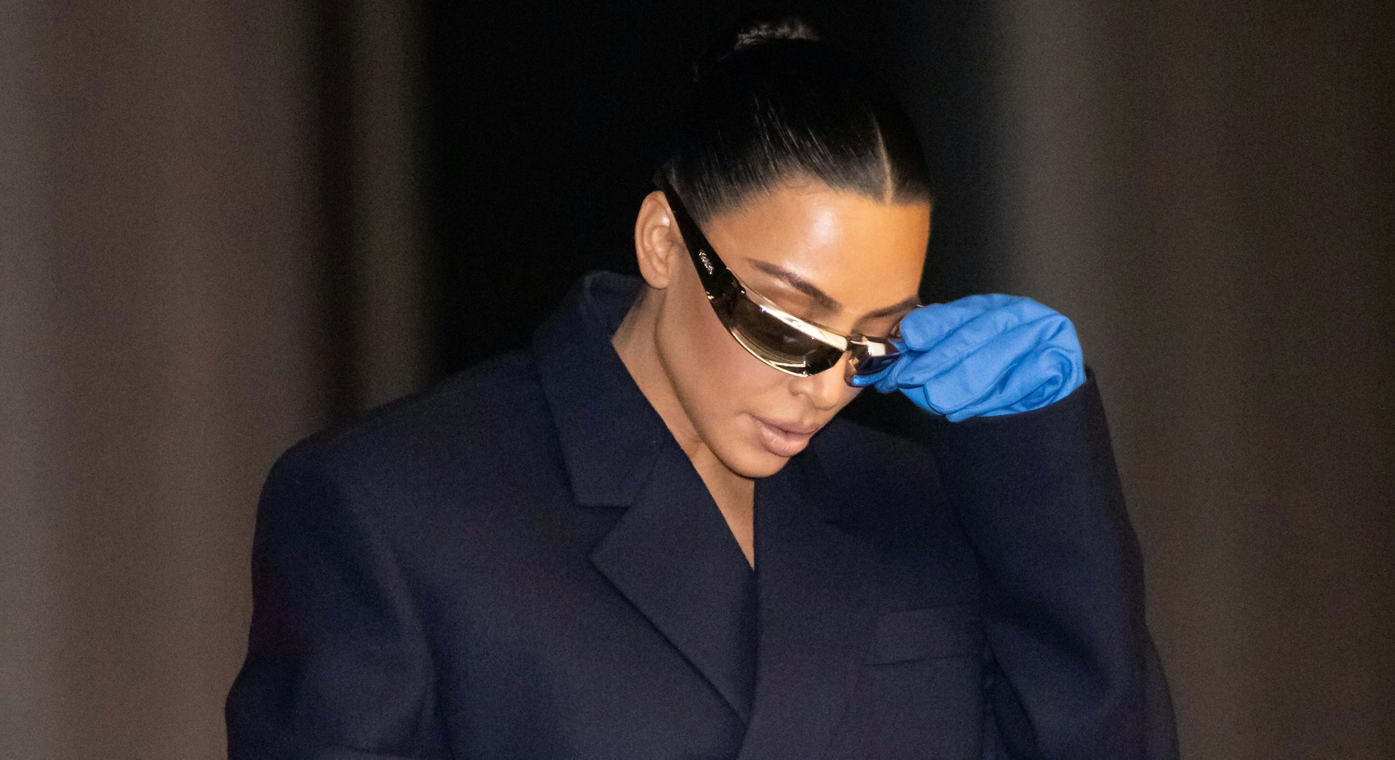 Kim Kardashian in giant gloves at Milan Fashion Week.  