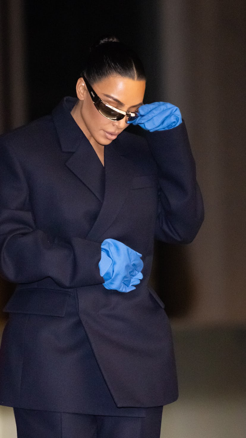 Kim Kardashian in giant gloves at Milan Fashion Week.  