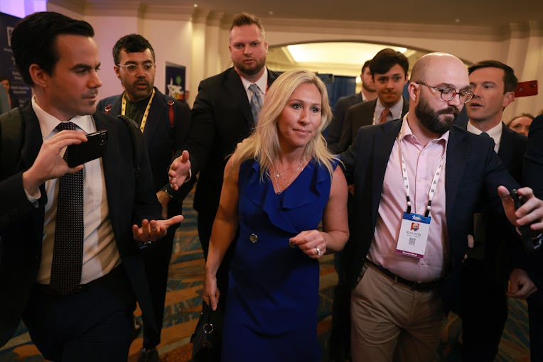ORLANDO, FLORIDA - FEBRUARY 26: Rep. Marjorie Taylor Greene (R-GA) is escorted through a throng of m...