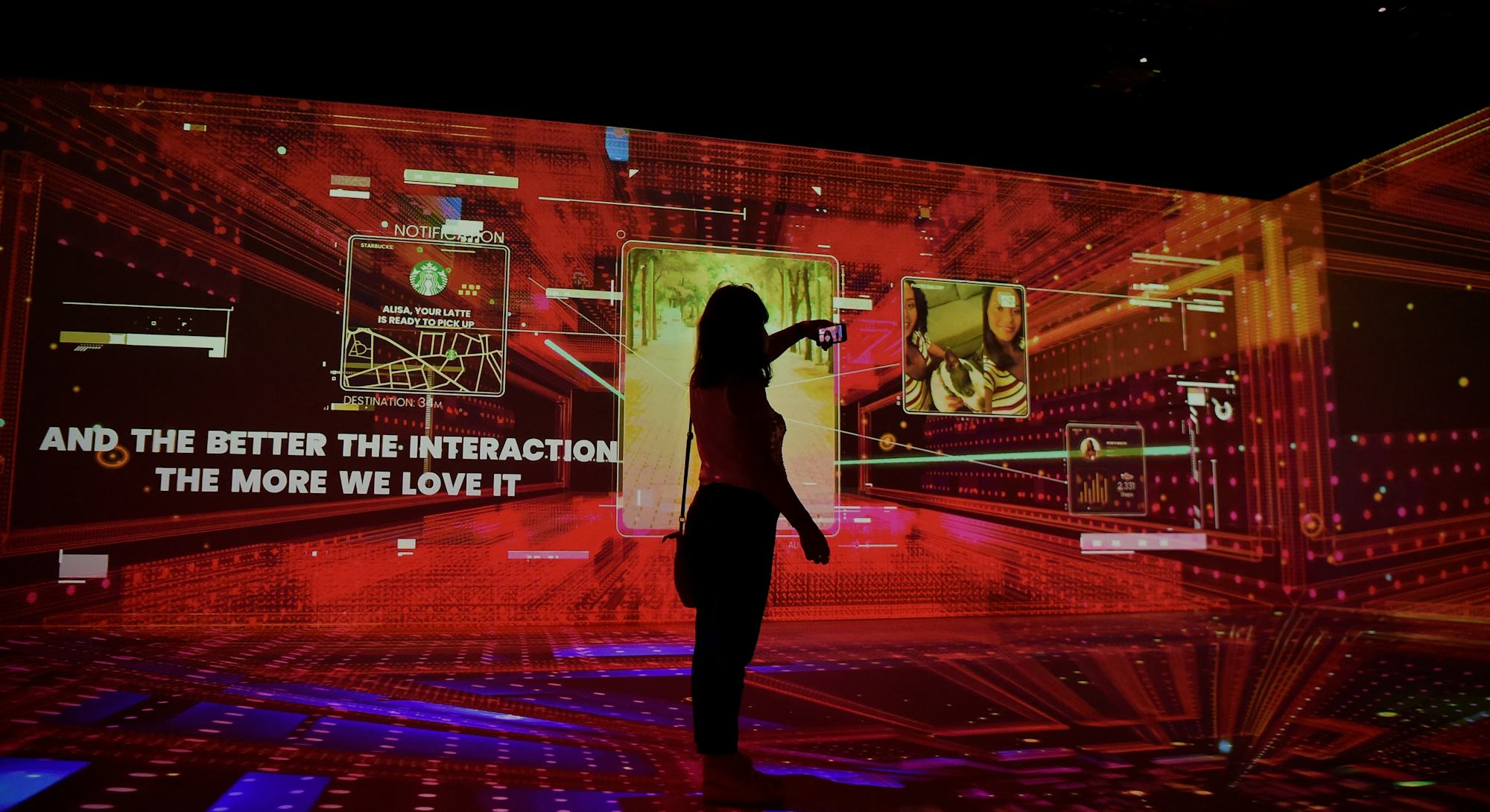 A woman uses her phone at the Mobile World Congress (MWC) fair in Barcelona on June 28, 2021. (Photo...