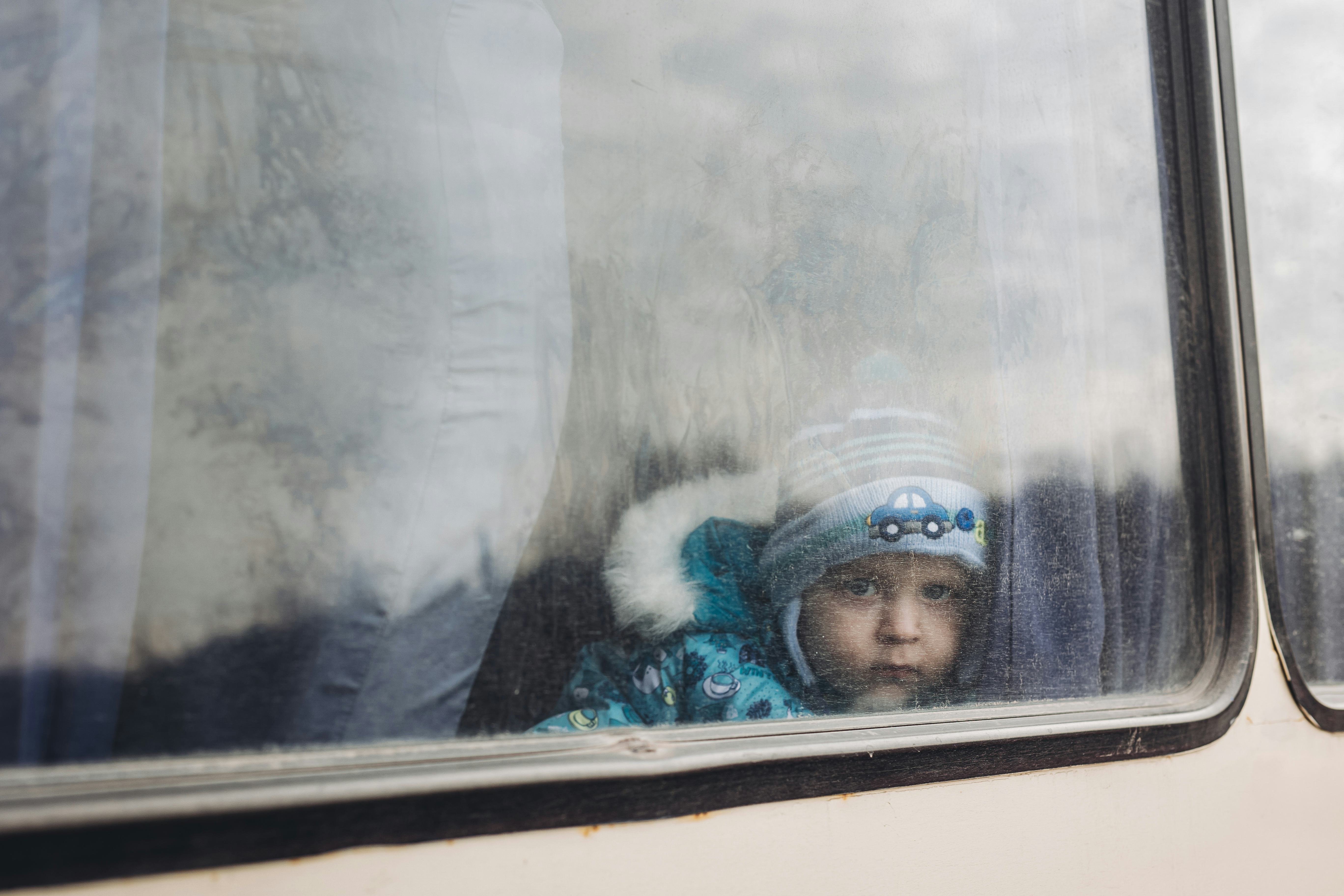 LISICHANSK, UKRAINE - FEBRUARY 24: A child on a bus in Lisichansk, February 24, 2022, in Lisichansk,...