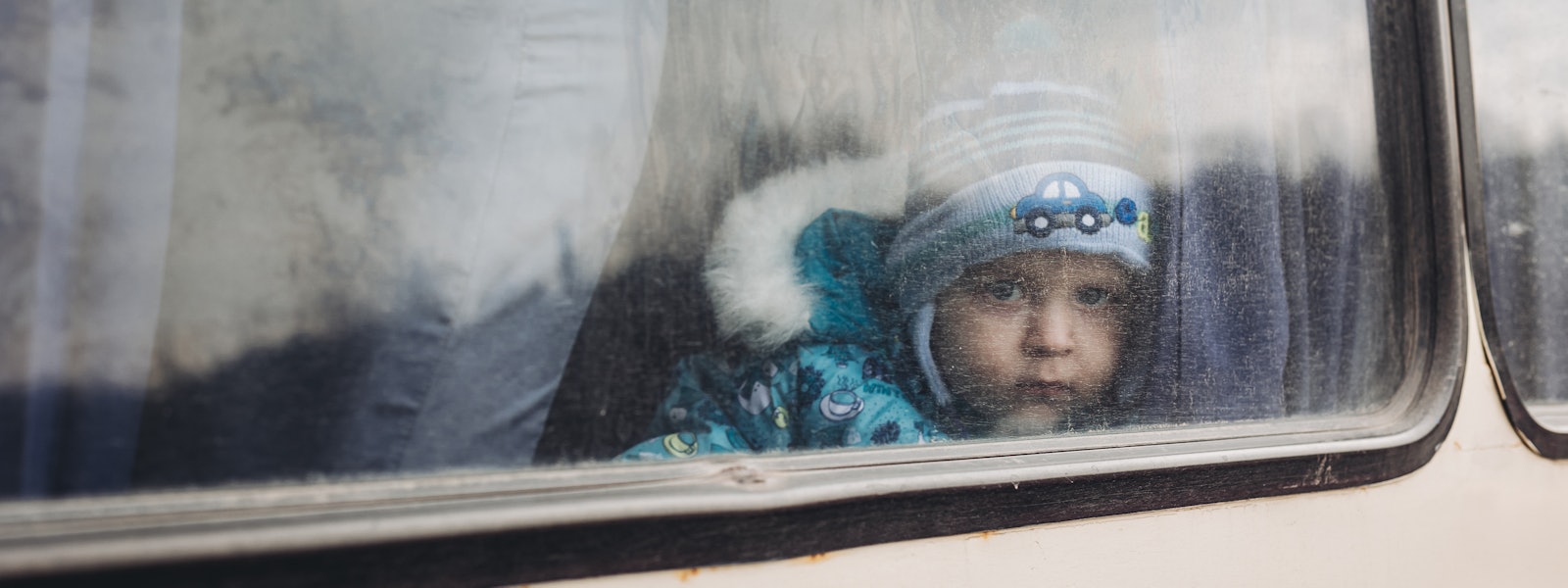 LISICHANSK, UKRAINE - FEBRUARY 24: A child on a bus in Lisichansk, February 24, 2022, in Lisichansk,...