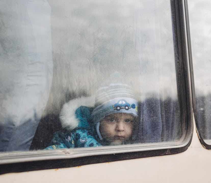 LISICHANSK, UKRAINE - FEBRUARY 24: A child on a bus in Lisichansk, February 24, 2022, in Lisichansk,...