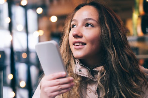 woman at a cafe on her phone