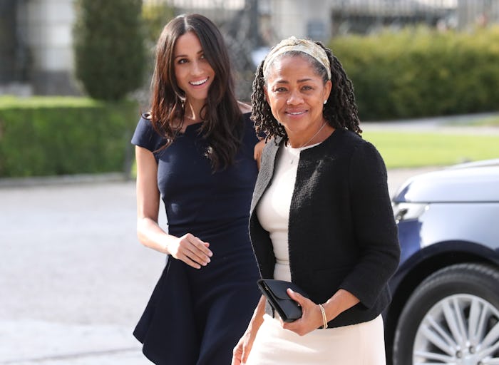 US actress and fiancee of Britain's Prince Harry Meghan Markle (L) arrives with her mother Doria Rag...