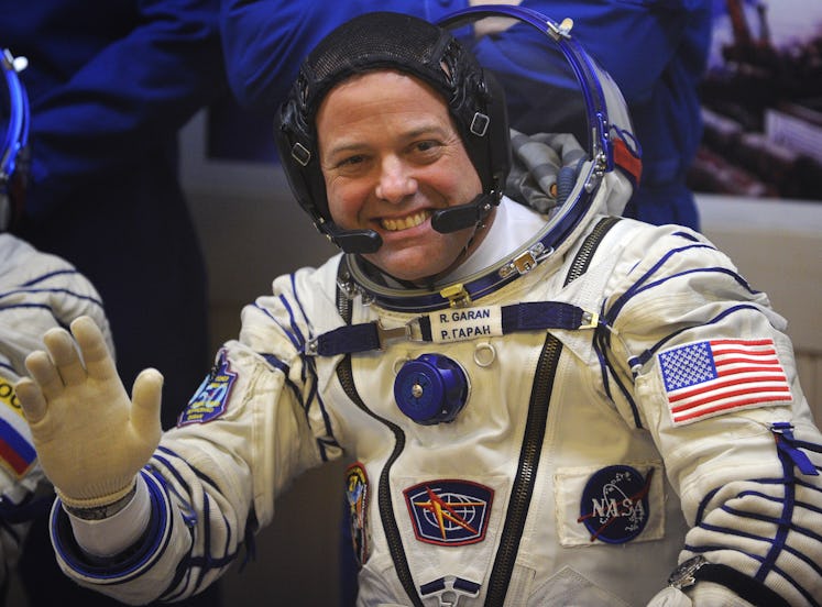 US astronaut Ron Garan waves during space suit testing prior to blast off on Russian Soyuz TMA-21 ro...
