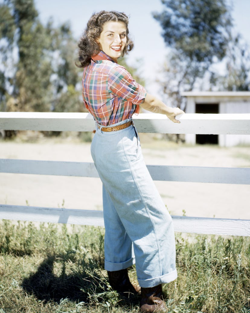 Actress Jane Russell wearing cuffed denim jeans in 1950. 