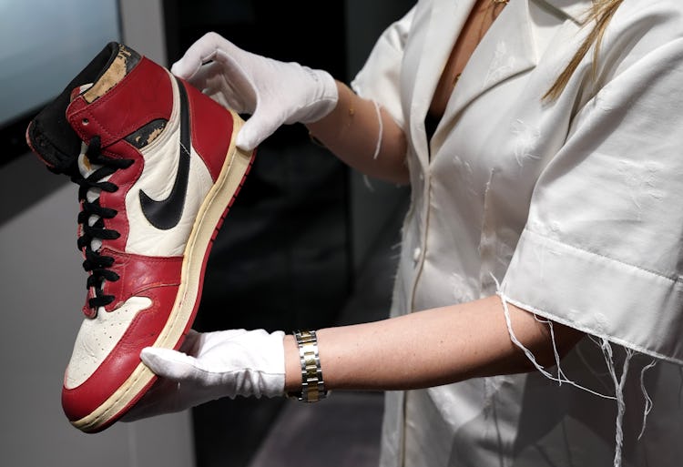 Caitlin Donovan Christies head of Sales, Handbags, and Accessories  holds the Air Jordan 1 High Shat...