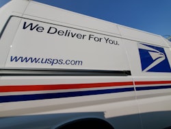Wide angle view of United States Postal Service (USPS) truck with logo visible, Lafayette, Californi...
