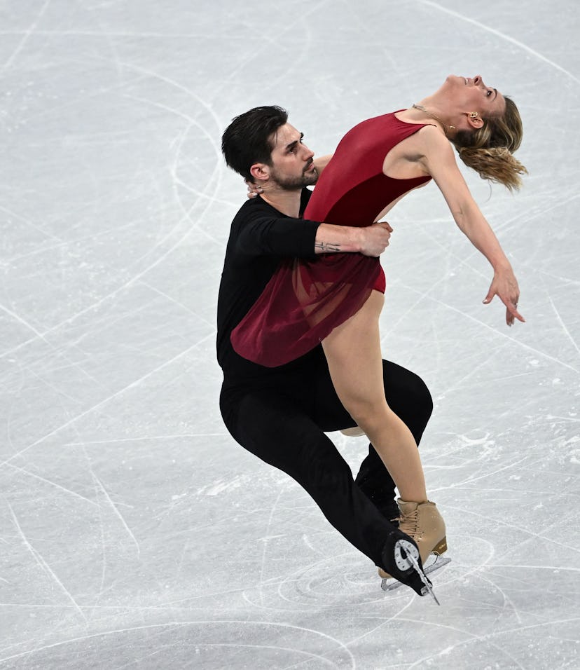 USA's Zachary Donohue and USA's Madison Hubbell take part in a training session at the Capital Indoo...