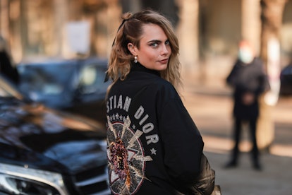 PARIS, FRANCE - JANUARY 24: Cara Delevingne is seen wearing a black Dior jacket outside Dior during ...