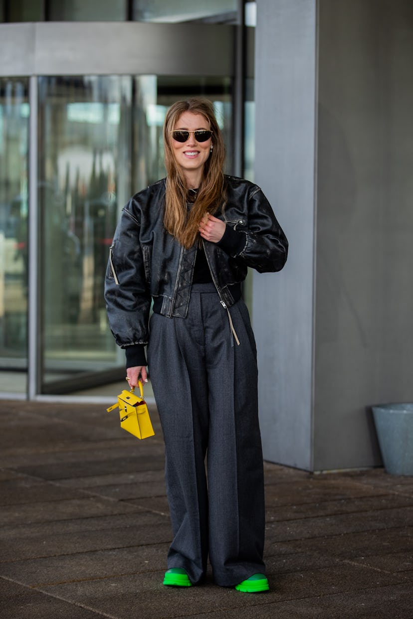 COPENHAGEN, DENMARK - FEBRUARY 02: Annabel Rosendahl seen wearing grey wide leg pants, leather jacke...