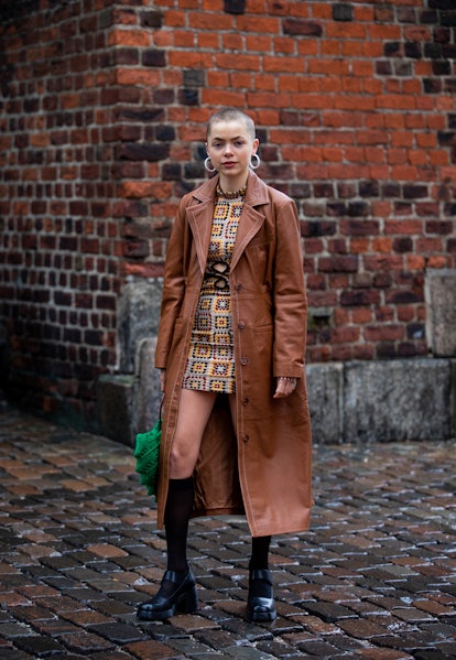 COPENHAGEN, DENMARK - FEBRUARY 01: Emma Fridsell wearing brown coat, green bag seen outside Iso.Poet...