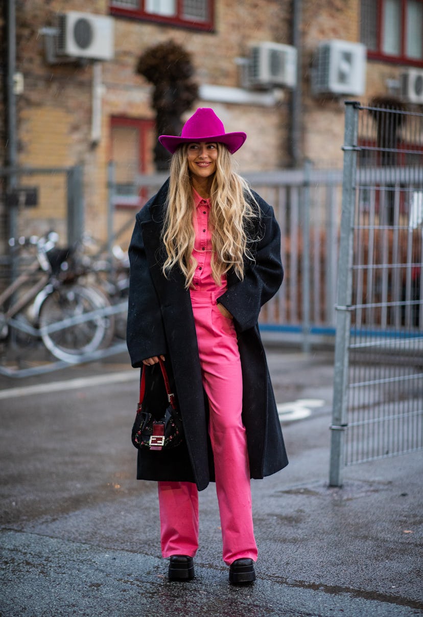 COPENHAGEN, DENMARK - FEBRUARY 01: Emili Sindlev seen wearing purple cowboy hat, pink pants and butt...