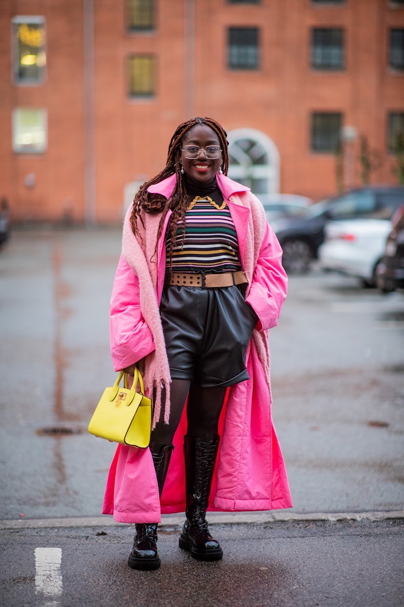 COPENHAGEN, DENMARK - FEBRUARY 01: Lois Opoku seen wearing black shorts, pink coat, yellow bag outsi...