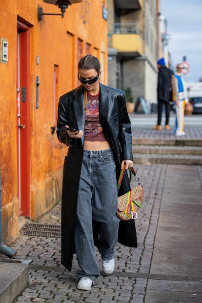 COPENHAGEN, DENMARK - FEBRUARY 02: Anna Winck seen wearing black leather coat, Dior saddle bag outsi...