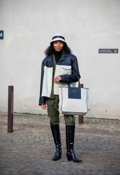 COPENHAGEN, DENMARK - FEBRUARY 01: Sara Flaaen Licius wearing two tone jacket, green pants, bag & ha...