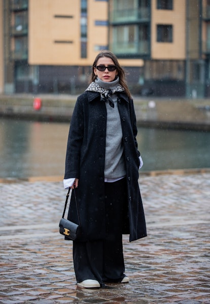 COPENHAGEN, DENMARK - FEBRUARY 01: Sarah Lou Falk seen wearing black coat, grey turtleneck outside G...