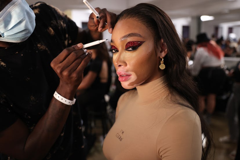 NEW YORK, NEW YORK - SEPTEMBER 09: Winnie Harlow prepares backstage for Laquan Smith during NYFW: Th...