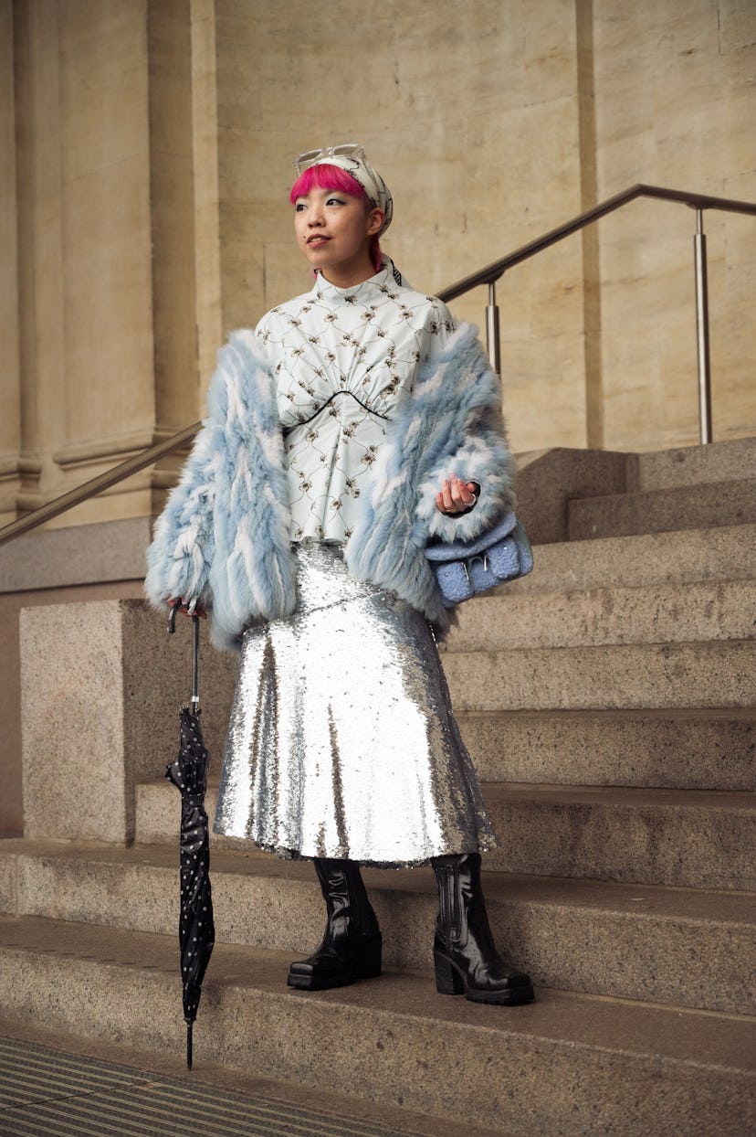 COPENHAGEN, DENMARK - FEBRUARY 03: Fumina T. wearing silver long skirt and light blue fur coat  outs...