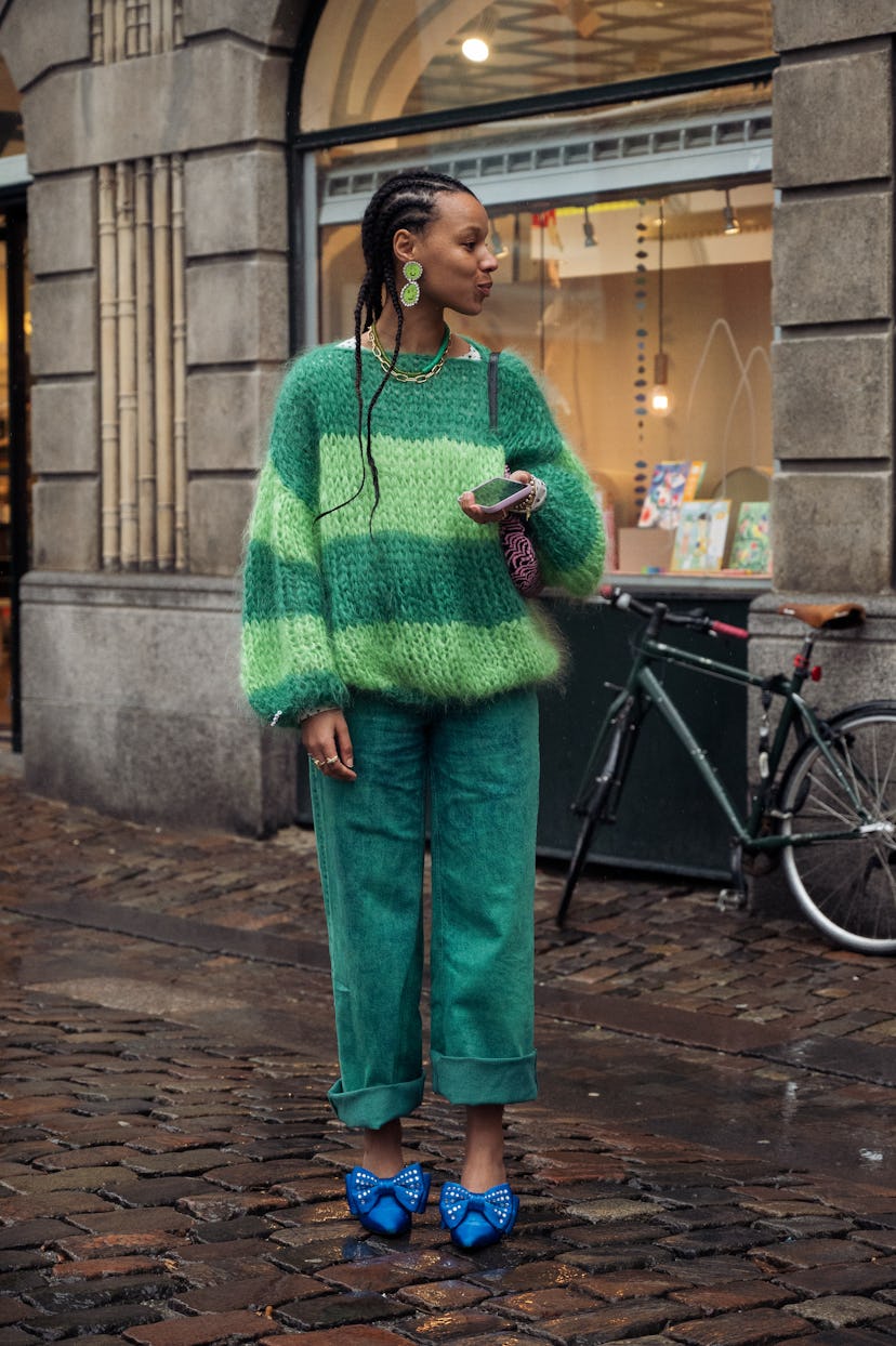 COPENHAGEN, DENMARK - FEBRUARY 03: Fia Hamelijnck wearing green pants, green sweater and blue shoes ...