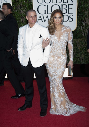 Jennifer Lopez and partner Casper Smart arrive at the 70th Annual Golden Globe Awards 
