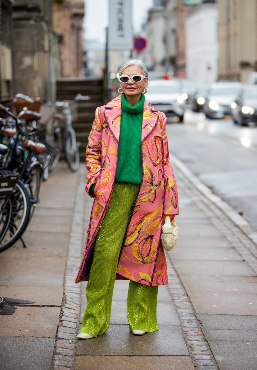 COPENHAGEN, DENMARK - FEBRUARY 02: Grece Ghanem is seen wearing pink coat with print, green turtlene...