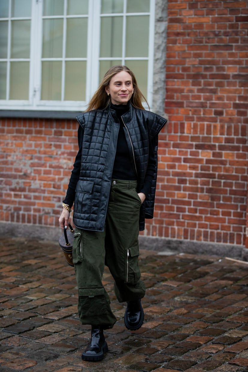 COPENHAGEN, DENMARK - FEBRUARY 01: Tine Andrea is seen wearing black puffer vest, olive pants, Louis...
