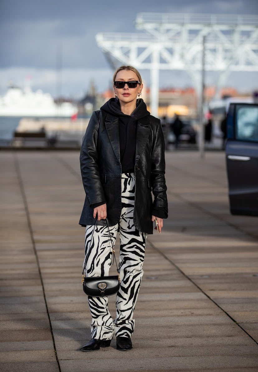 COPENHAGEN, DENMARK - FEBRUARY 02: Justyna Czerniak seen wearing zebra print pants, black Dior bag, ...