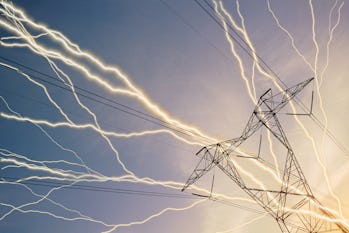Lightning bolt streaks across blue sky